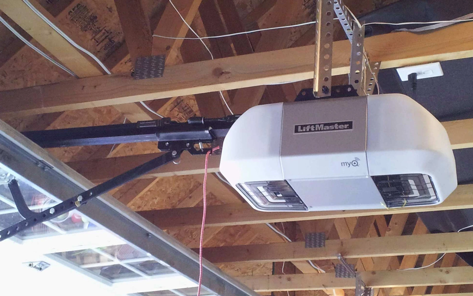 A LiftMaster garage door opener being repaired by Transcona Overhead Doors